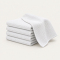 Stack of folded white microfiber cleaning cloths
